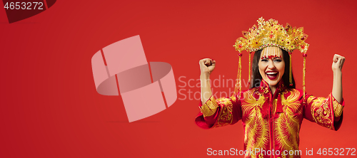 Image of Chinese traditional woman. Beautiful young girl wearing in national costume