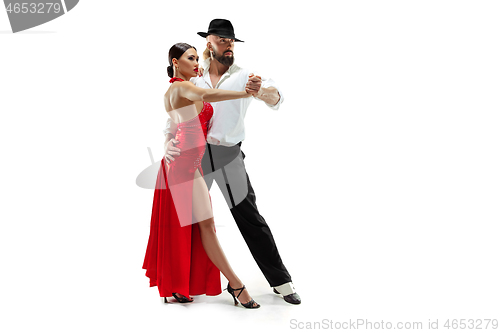 Image of Portrait of young elegance tango dancers. Isolated over white background