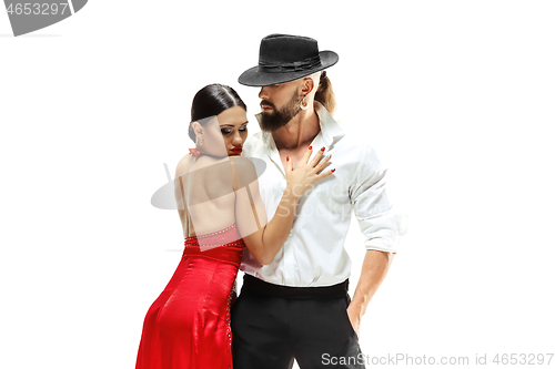 Image of Portrait of young elegance tango dancers. Isolated over white background