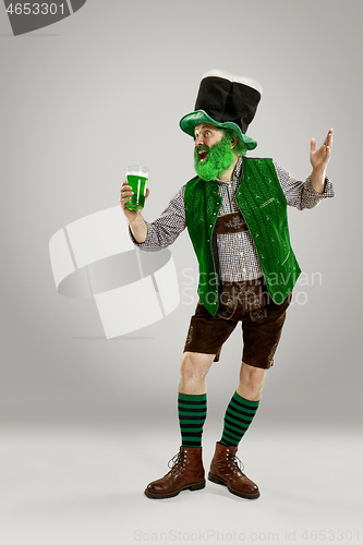 Image of A man in a leprechaun hat at studio. He celebrates St. Patrick\'s Day.