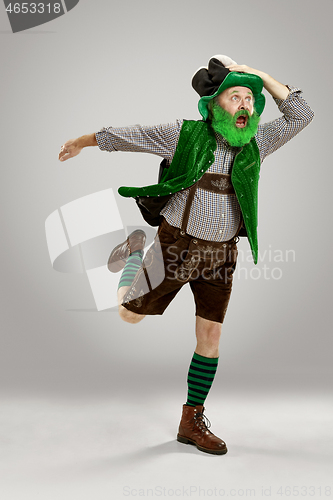 Image of A man in a leprechaun hat at studio. He celebrates St. Patrick\'s Day.