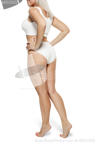 Image of Female body with the drawing arrows. Fat lose, liposuction and cellulite removal concept