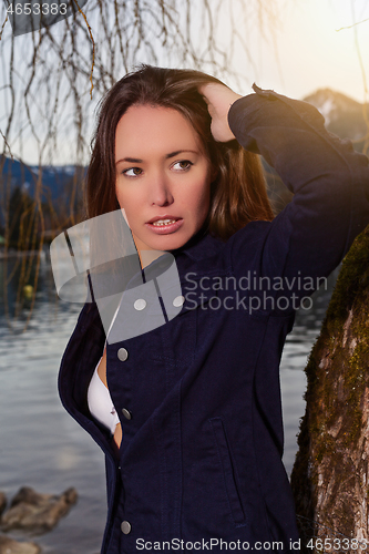 Image of Portrait of a young brunette woman at the lake