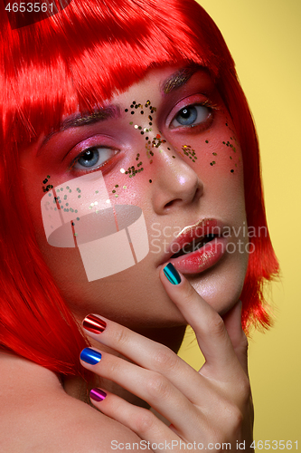 Image of Beautiful girl in red wig