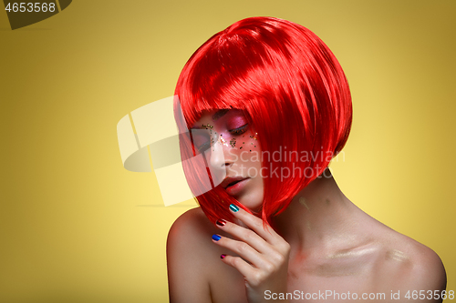 Image of Beautiful girl in red wig