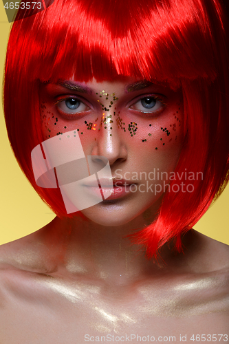 Image of Beautiful girl in red wig