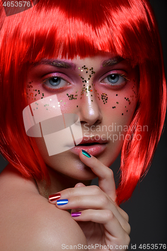 Image of Beautiful girl in red wig