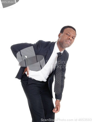 Image of Man with back pain bending forward
