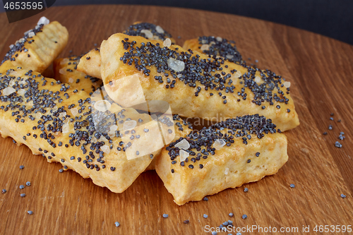 Image of baked sticks with poppy seeds, salt