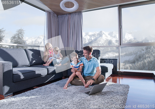 Image of Happy family playing a video game