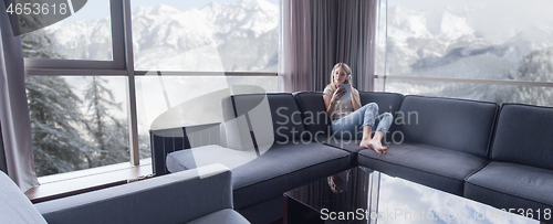 Image of young girl enjoying music through headphones