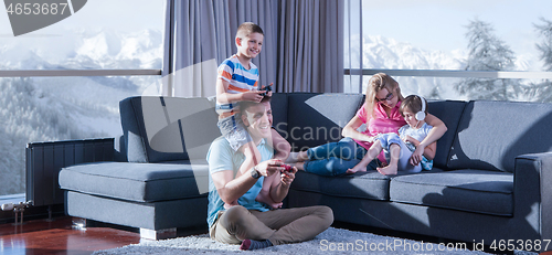 Image of Happy family playing a video game