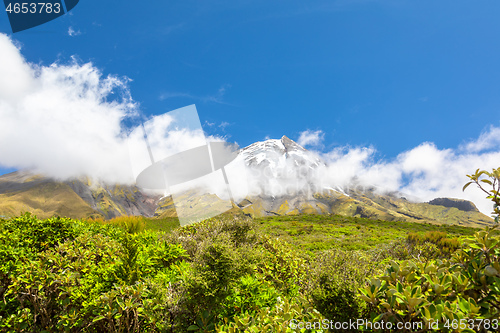 Image of volcano Taranaki covered in clouds, New Zealand 