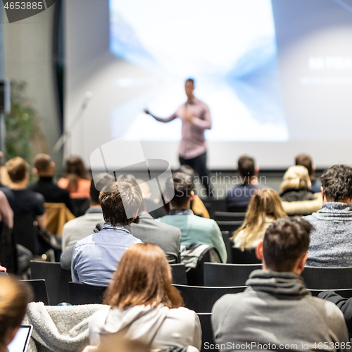 Image of Business speaker giving a talk at business conference event.