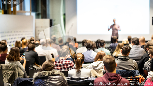 Image of Business speaker giving a talk at business conference event.