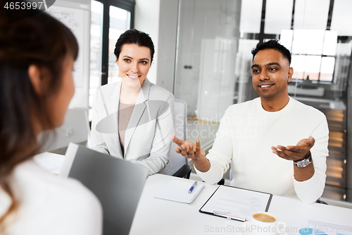 Image of recruiters having job interview with employee