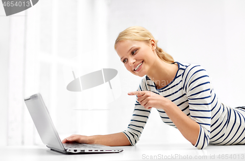 Image of woman having video call on laptop computer at home