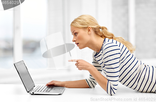 Image of woman having video call on laptop computer at home