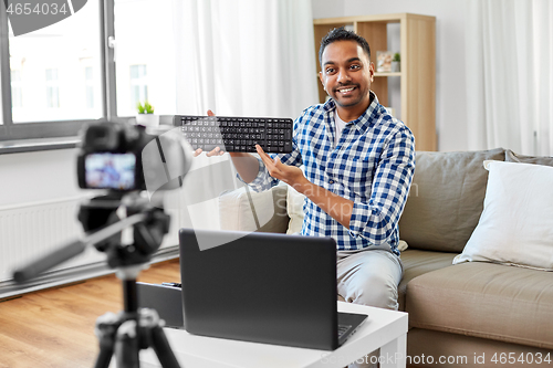 Image of male video blogger with keyboard videoblogging