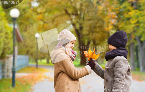 Image of smiling children in autumn park