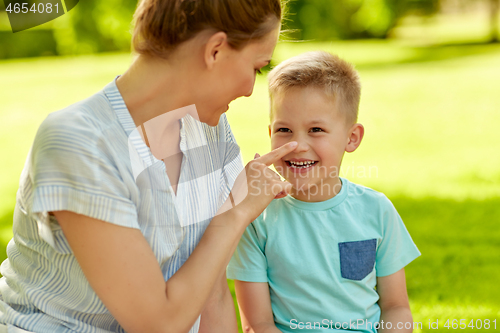 Image of happy mother and son at summer park