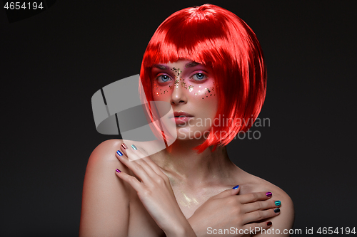 Image of Beautiful girl in red wig