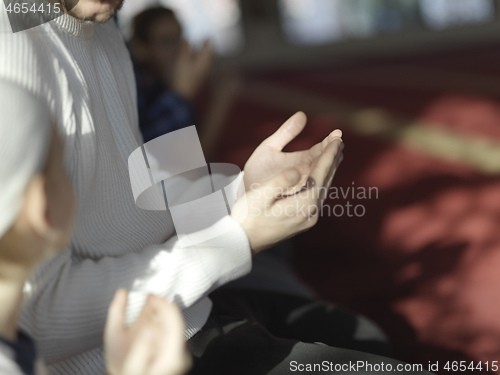 Image of muslim people praying in mosque