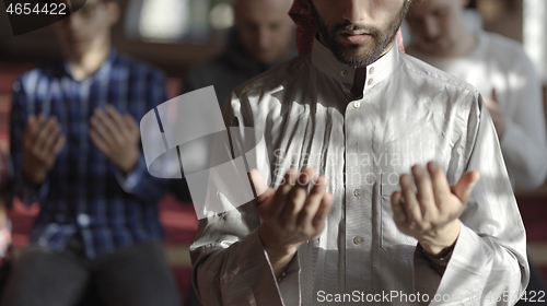 Image of muslim people praying in mosque