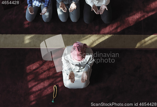 Image of muslim people praying in mosque  top view