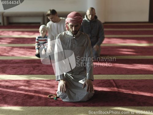 Image of muslim people praying in mosque