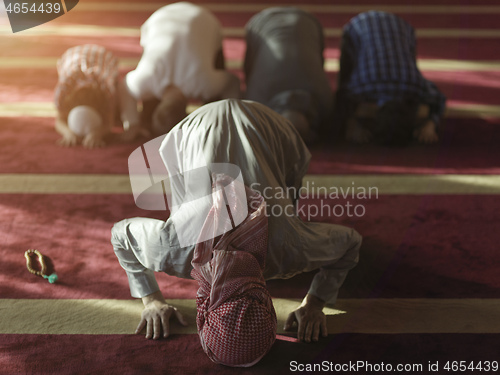 Image of muslim people praying in mosque