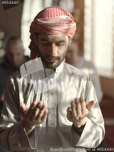 Image of muslim people praying in mosque