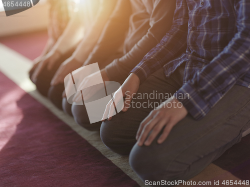 Image of muslim people praying in mosque