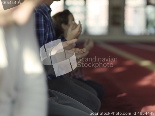 Image of muslim people praying in mosque