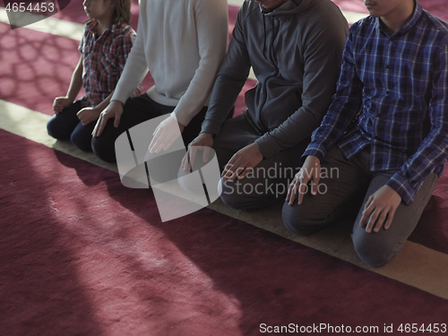 Image of muslim people praying in mosque