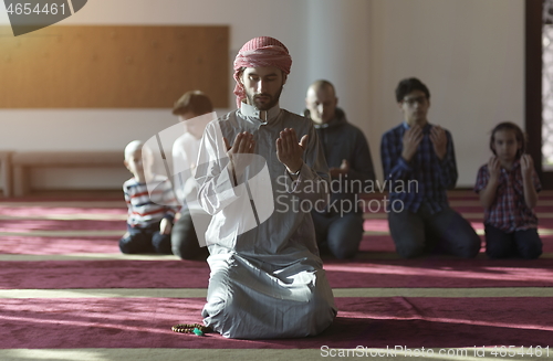 Image of muslim people praying in mosque