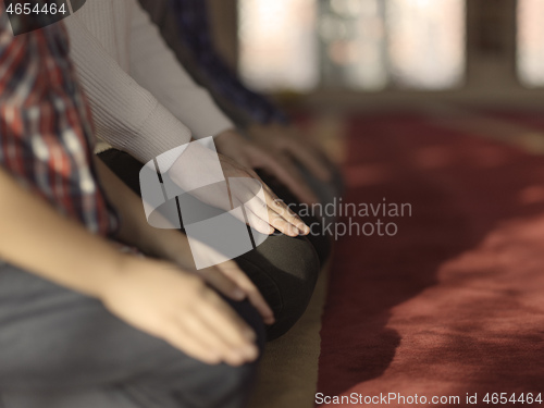 Image of muslim people praying in mosque