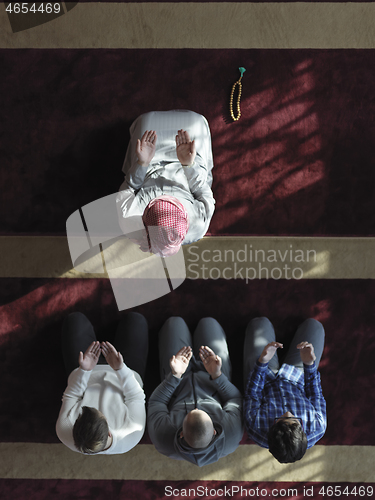 Image of muslim people praying in mosque  top view