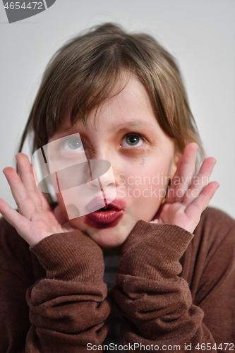 Image of Little girl playing with mommy\'s make up