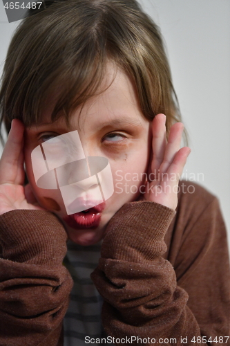 Image of Little girl playing with mommy\'s make up