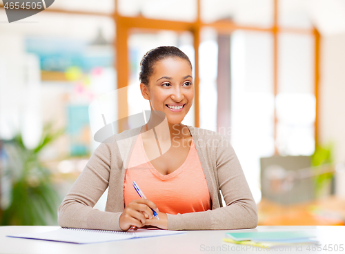 Image of african american female student with notebook