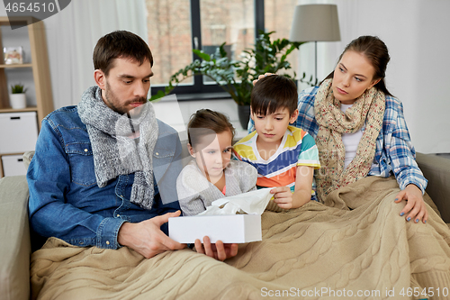 Image of ill family with children having flu at home