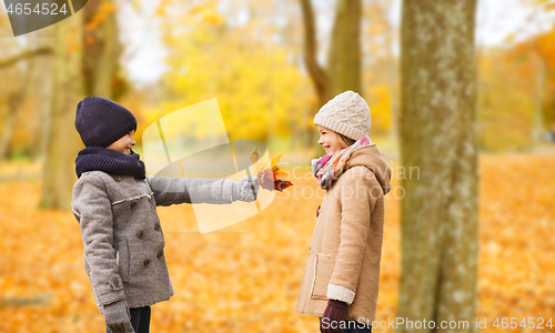 Image of smiling children in autumn park