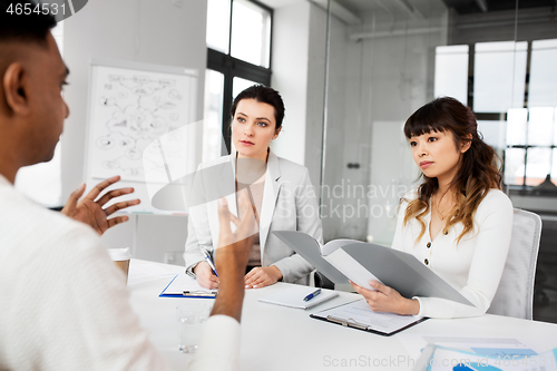 Image of recruiters having job interview with employee