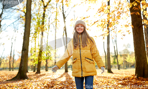 Image of happy girl at autumn park