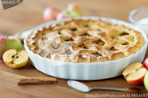 Image of close up of apple pie on wooden table