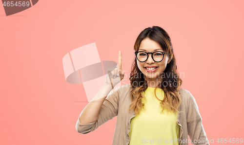 Image of asian woman in glasses or student with finger up