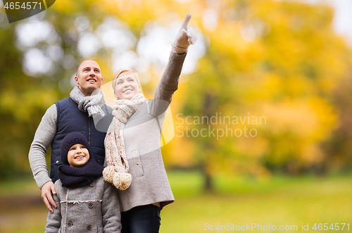 Image of happy family in autumn park