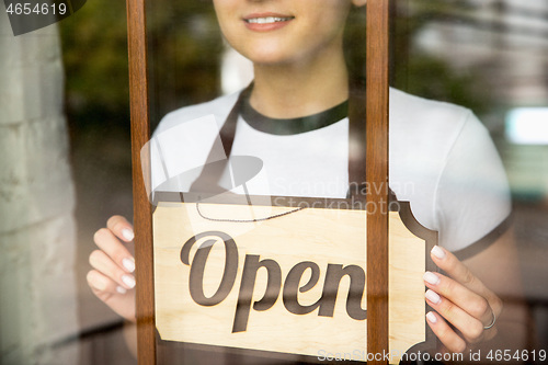 Image of Open sign on the glass of street cafe or restaurant
