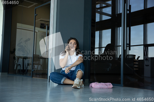 Image of Young woman waiting for departure in airport, traveler with small baggage, influencer\'s lifestyle